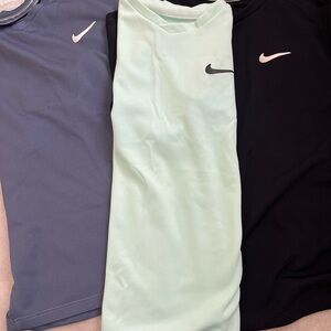 Bundle Nike T-Shirts in Black, Mint Green, and Slate Blue